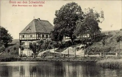 Ak Neuhausen im Erzgebirge, Gruss aus dem Schweinitztal, altes Bauernhaus v. J. 1686