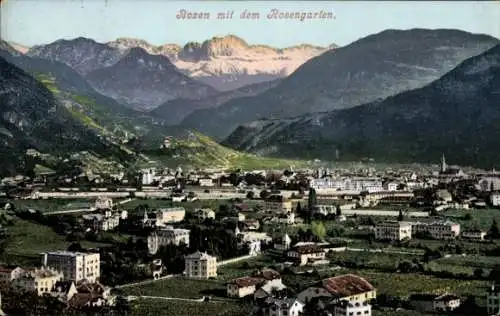 Ak Bozen Bolzano Südtirol, Panoramablick über den Ort auf den Rosengarten