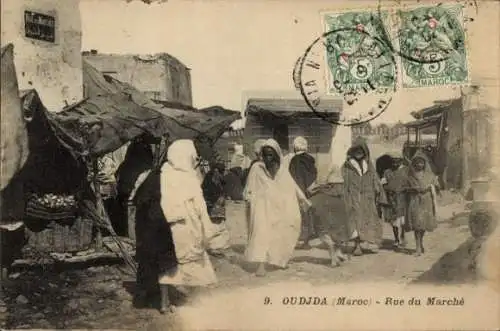 Ak Oudjda Oujda Marokko, Rue du Marche, Einheimische, Geschäfte, Häuser