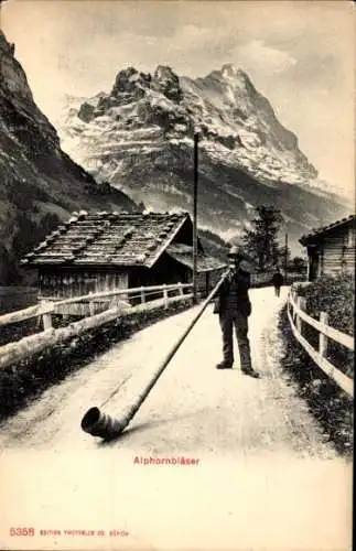 Ak Schweiz, Alphornbläser auf der Straße, Alpen, Häuser