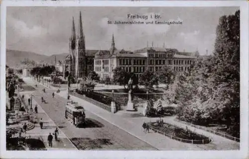 Ak Freiburg im Breisgau Baden Württemberg, St. Johanniskirche und Lessingschule, Straßenbahn