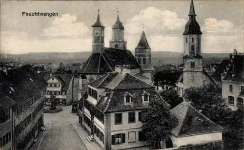 Ak Feuchtwangen in Mittelfranken, Teilansicht, Kirche, Straßenpartie