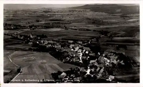 Ak Urspringen Ostheim vor der Rhön Unterfranken, Die Vorderseite zeigt ein schwarz-weiß Luftbi...