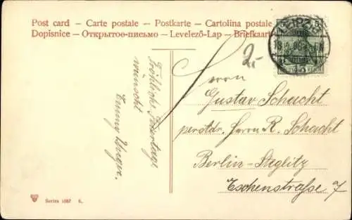 Künstler Ak Frohe Ostern, Frau mit Hasen am Zaun