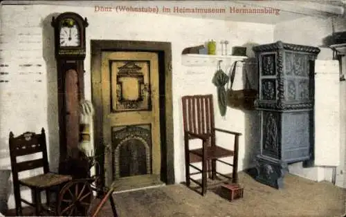 Ak Hermannsburg Lüneburger Heide, Dönz Wohnstube im Heimatmuseum, Ofen, Uhr