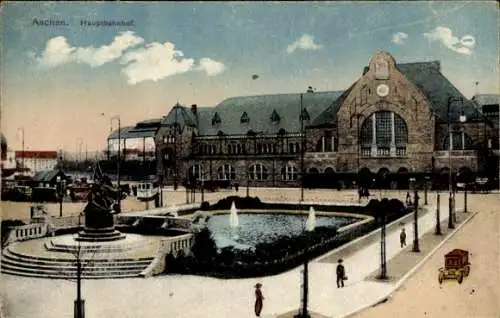 Ak Aachen, Hauptbahnhof, Brunnen, Wasserfontänen, Kriegerdenkmal, Platz