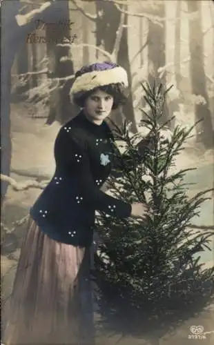 Ak Weihnachten, Frau mit Tannenbaum