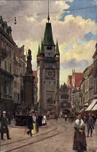 Künstler Ak Hoffmann, H., Freiburg im Breisgau, Kaiserstraße mit Martinstor