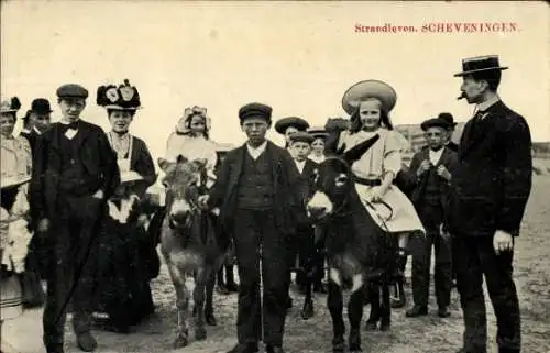 Ak Scheveningen Den Haag Südholland, Strandleben, Menschengruppe, Kinder reiten auf Esel