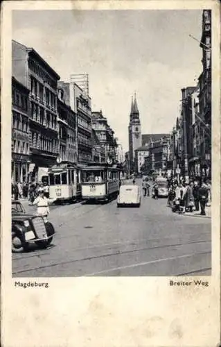 Ak Magdeburg an der Elbe, Breiter Weg, Straßenbahn Linie 1 u. 2, Verkehrspolizist, Autos, Kirche