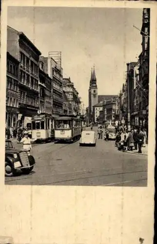 Ak Magdeburg an der Elbe, Breiter Weg, Straßenbahn Linie 1 u. 2, Verkehrspolizist, Autos, Kirche