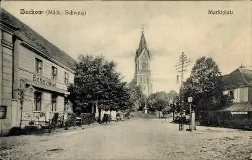 Ak Buckow in der Märkischen Schweiz, Marktplatz mit Ecks Hotel und Kirchturm