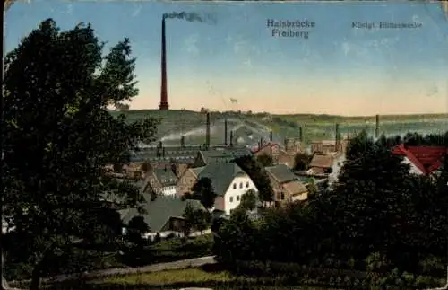 Ak Halsbrücke in Sachsen, Gesamtansicht, Schornsteine einer Hütte