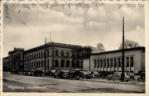 Ak Magdeburg an der Elbe, Hauptbahnhof, Straßenbahn, Autos, Gebäude