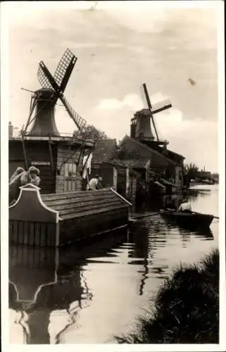 Ak Niederlande, überschwemmtes Haus, Windmühlen