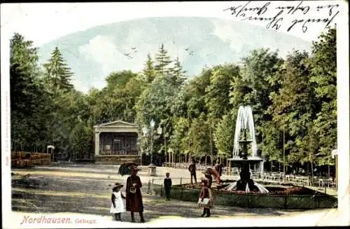 Ak Nordhausen am Harz, Nordhausen Gehege, Personen mit Regenschirm und Hut flanieren an einem ...