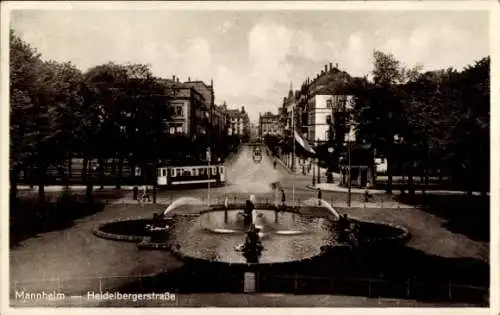 Ak Mannheim in Baden,  Heidelbergerstraße, Straßenbahn, Brunnen, Bäume, Gebäude