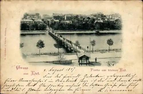 Ak Kiel, Vielzählige Bäume, Brücke über Wasser, Wohngebäude im Hintergrund, alte Postkarte