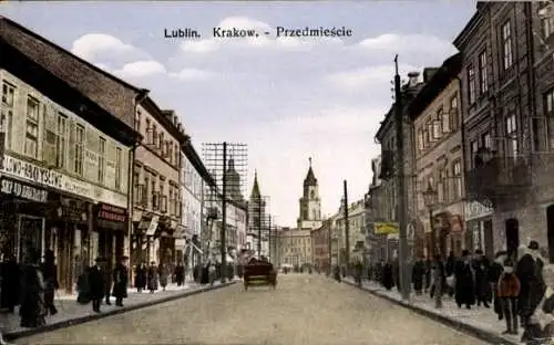 Ak Kraków Krakau Polen, Straße in  Geschäfte, Menschenmenge, historische Gebäude