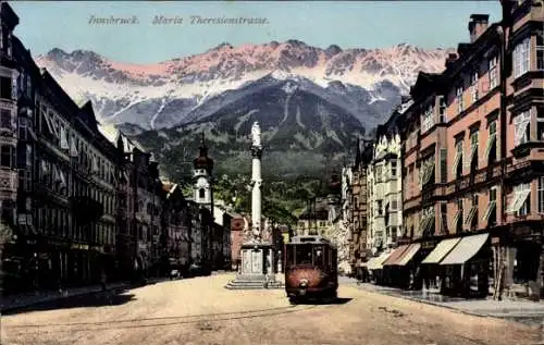 Ak Innsbruck in Tirol, Maria Theresienstraße, Straßenbahn, Denkmal, Bergpanorama