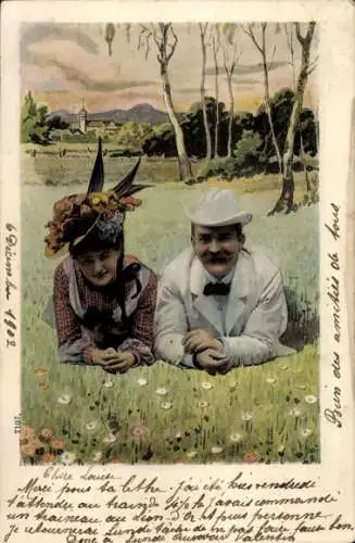 Ak Paar liegt auf einer Wiese