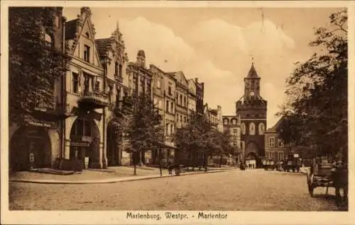 Ak Malbork Marienburg Westpreußen, Straßenpartie mit Blick auf das Marientor, Rösterei J. Man