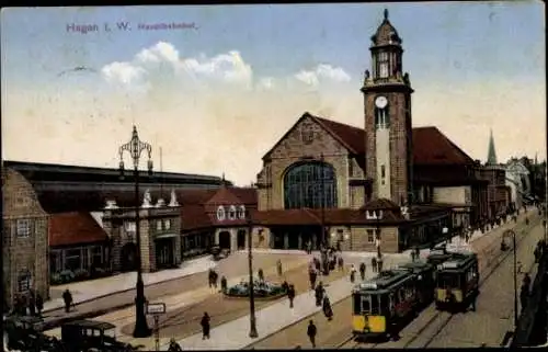 Ak Hagen in Westfalen, Personen am Bahnhof, Straßenbahn, Bahnhofsuhr, Gebäude