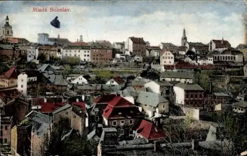 Ak Mladá Boleslav Jungbunzlau Mittelböhmen, Stadtansicht mit bunten Dächern, Wolken, Häusern, ...