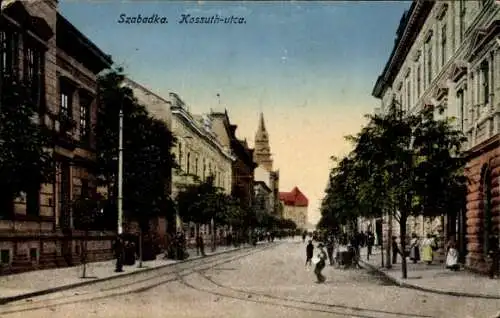 Ak Szabadka Subotica Serbien,  Kossuth-Utca, historische Architektur, belebte Straße, Bäume