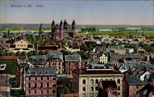Ak Worms am Rhein, Stadtansicht mit Gebäuden und Türmen, grüne Landschaft im Hintergrund
