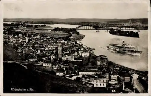 Ak Rüdesheim am Rhein, Stadtansicht, Rhein, Brücke, Dampfschiff, alte Gebäude