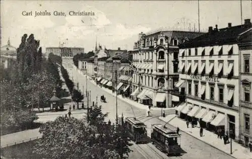 Ak Christiania Oslo Norwegen, Carl Johans Gate, GRAND HOTEL, Straße mit Tram