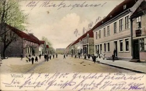 Ak Bad Wilsnack in der Prignitz, Farbenfrohe Straße, Wohnhäuser, Menschen, historische Archite...