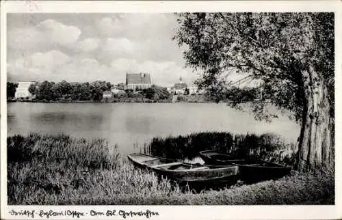 Ak Iława Deutsch Eylau Westpreußen, , Blick auf die Stadt Deutsch Eylau mit See und zwei Boote...