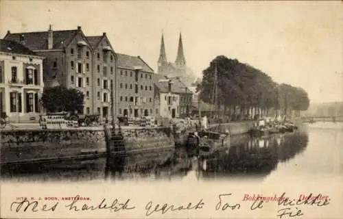 Ak Amsterdam Nordholland Niederlande, Schöne Stadtansicht, Gebäude und Kirchtürme, Bootsanlege...