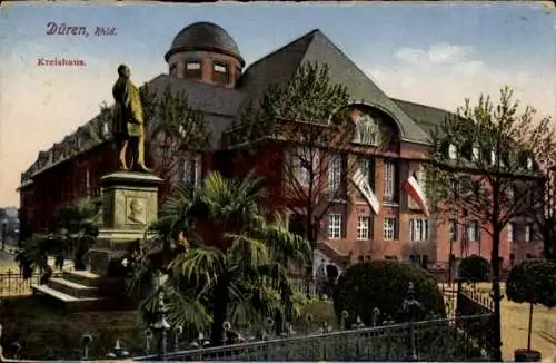 Ak Düren im Rheinland, Dürener Kreishaus, Statue, Bäume, Zäune, historische Architektur