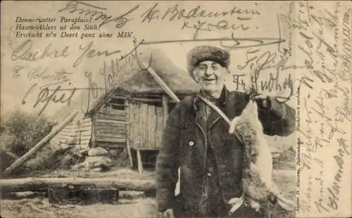 Ak Kaninchenjagd, Jäger mit Beute