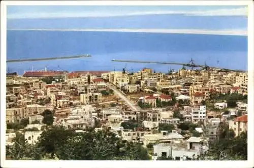 Ak Haifa Israel, Panoramablick auf eine Stadt, Meer im Hintergrund, beeindruckende Architektur