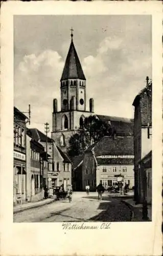 Ak Wittichenau in der Oberlausitz, Straßenpartie, Kirche