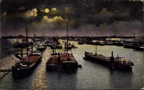 Ak Duisburg im Ruhrgebiet, Abend am Hafen, Frachtschiffe