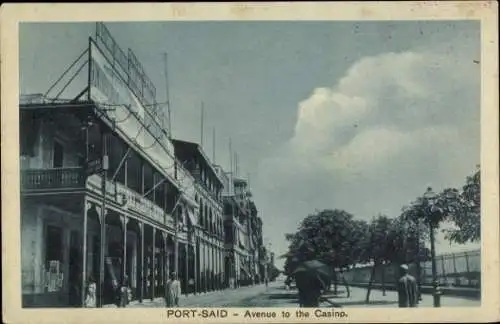 Ak Port Said Ägypten, Vorderseite zeigt Casino-Avenue, Bäume, Gebäude, Personen