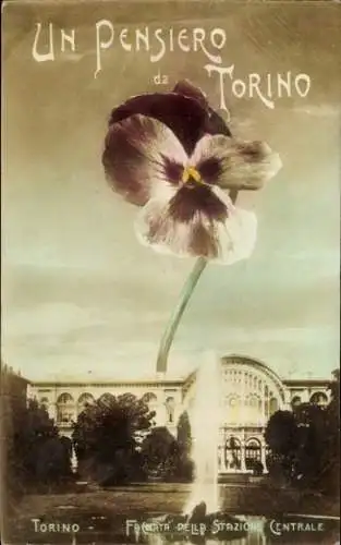 Ak Torino Turin Piemonte,  mit einer blühenden Balkonblume, Bahnhof Torino im Hintergrund