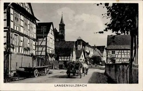 Ak Langensoultzbach Langensulzbach Elsass Bas Rhin, Viel Fachwerkhäuser, Dorfstraße, Kirche im...