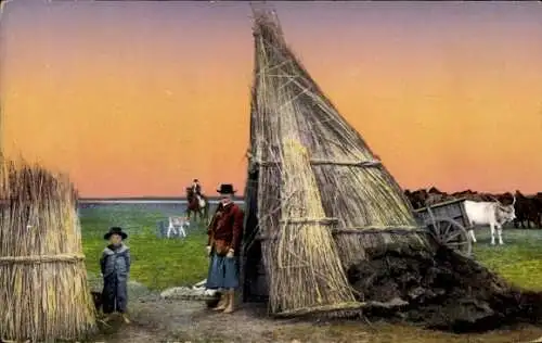 Ak Ungarn, Leben auf der Heide Hortobagy, Ungarische Hirten, Strohhütte auf einem Feld