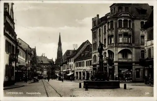 Ak Offenburg in Baden Schwarzwald, Stadtansicht, Hauptstraße, Architektur, Kirche, Statuen