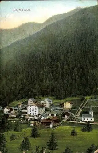 Ak Gomagoi Stilfs Stelvio Südtirol, Dorfansicht, Berge, mehrstöckige Gebäude, Kirche, ländliche L