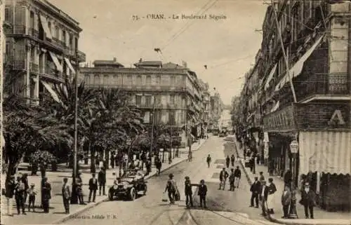 Ak Oran Algerien, Boulevard Séguin,  Straßenansicht, Fahrzeuge, Menschen, Palmen