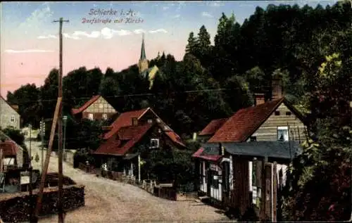 Ak Schierke Wernigerode im Harz, Dorfstraße mit Kirche, Häuser, Bäume, ländliche Landschaft