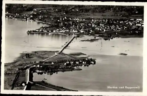 Ak Rapperswil Kanton Sankt Gallen, Luftaufnahme von Hurden und  Brücke sichtbar, Landschaft
