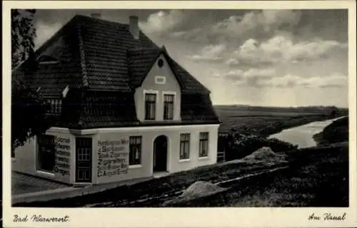 Ak Nordseebad Warwerort in Dithmarschen, Am Kanal, Geschäftshaus C. August Ernst